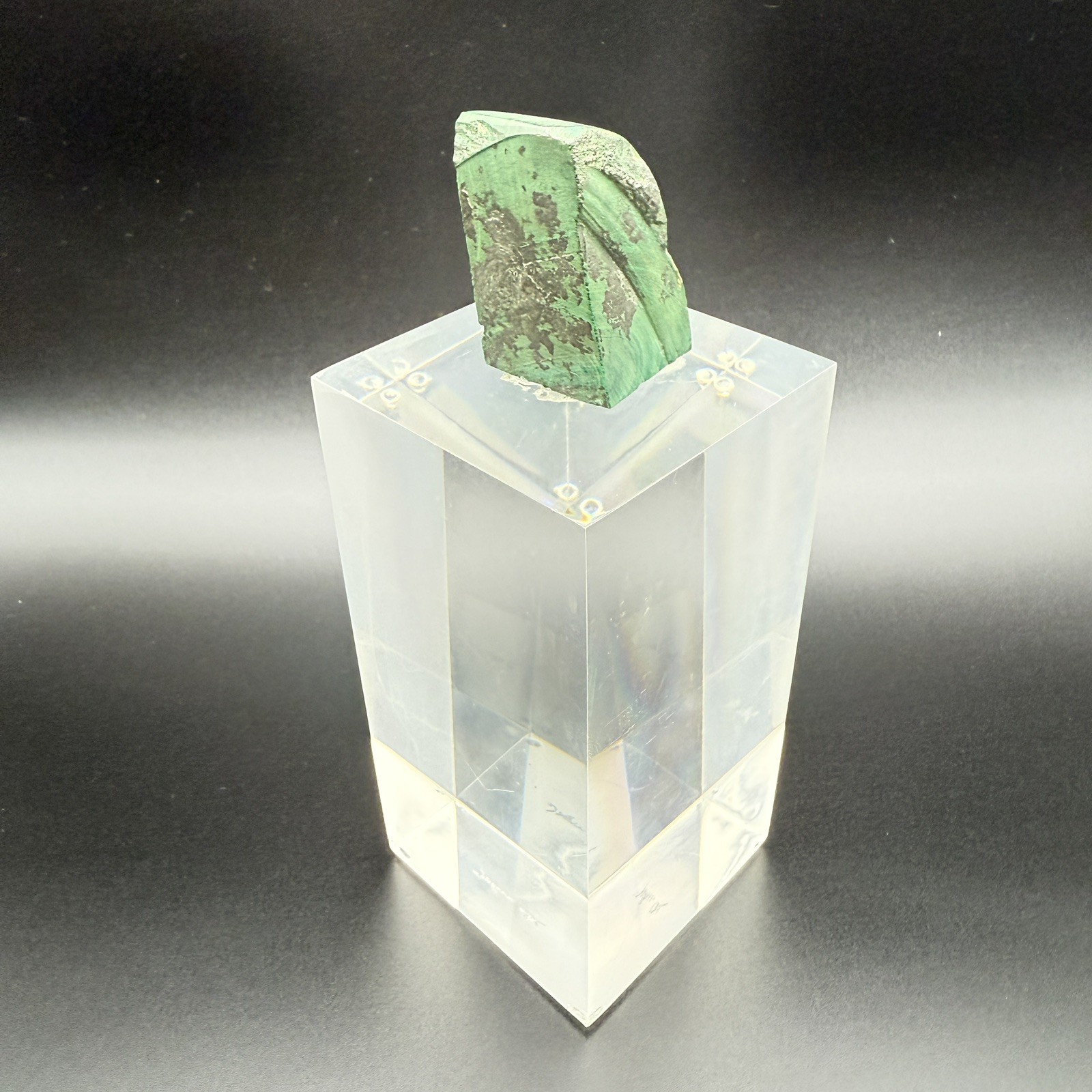 Dark green banded malachite on a lucite Base artist Unknown Signed – “?” Ax