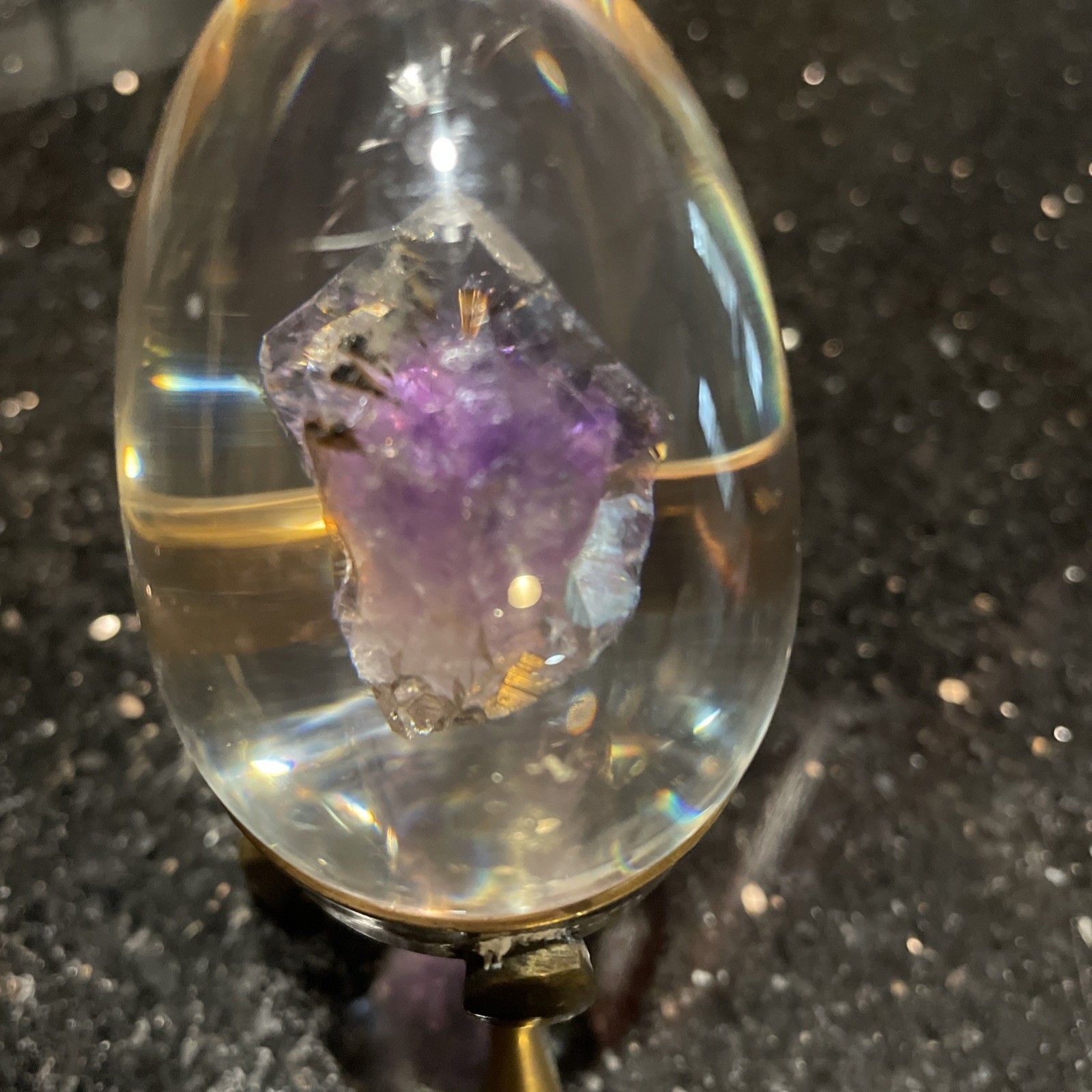 Amethyst Egg Encased In Lucite With Linear Inclusions With Brass Stand