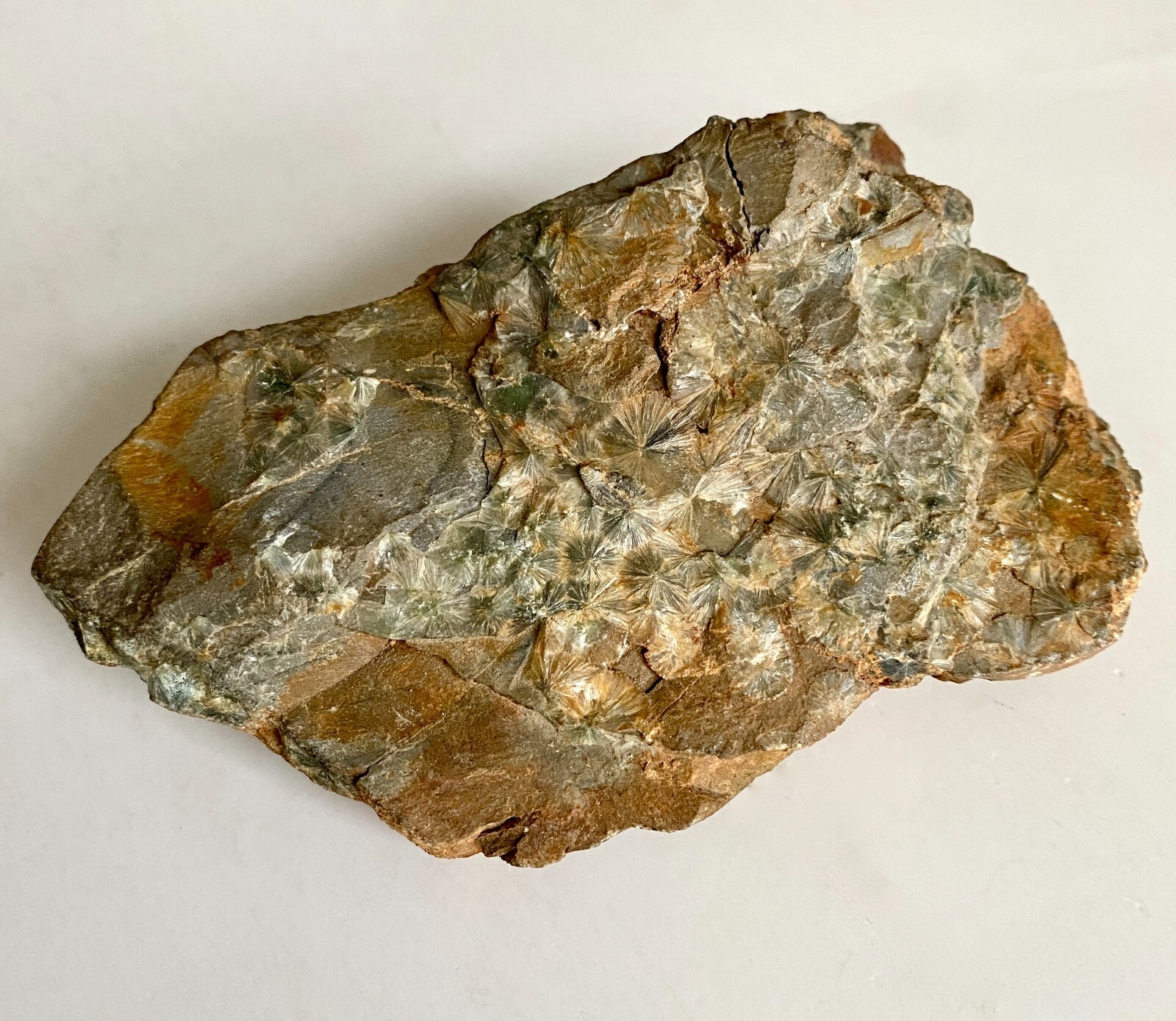 Wavellite starburst translucent crystal clusters on matrix, light green, brown