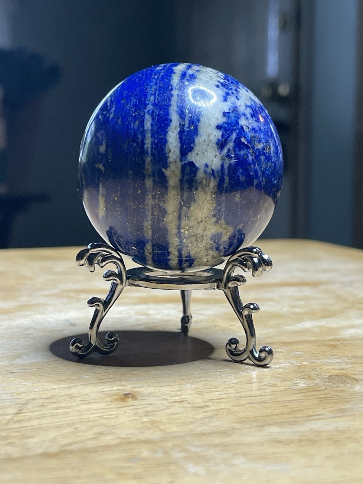 Polished Lapiz Lazuli Sphere with Pyrite Inclusions on Display Stand