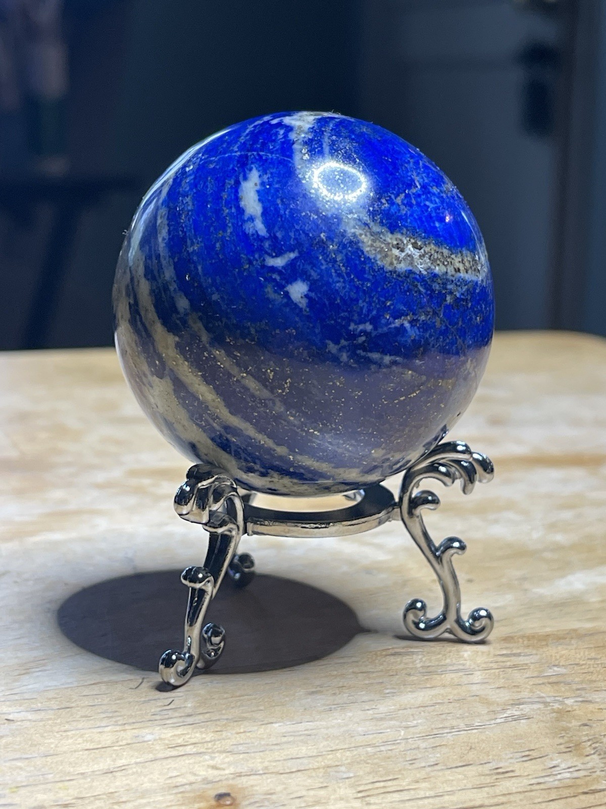 Polished Lapiz Lazuli Sphere with Pyrite Inclusions on Display Stand