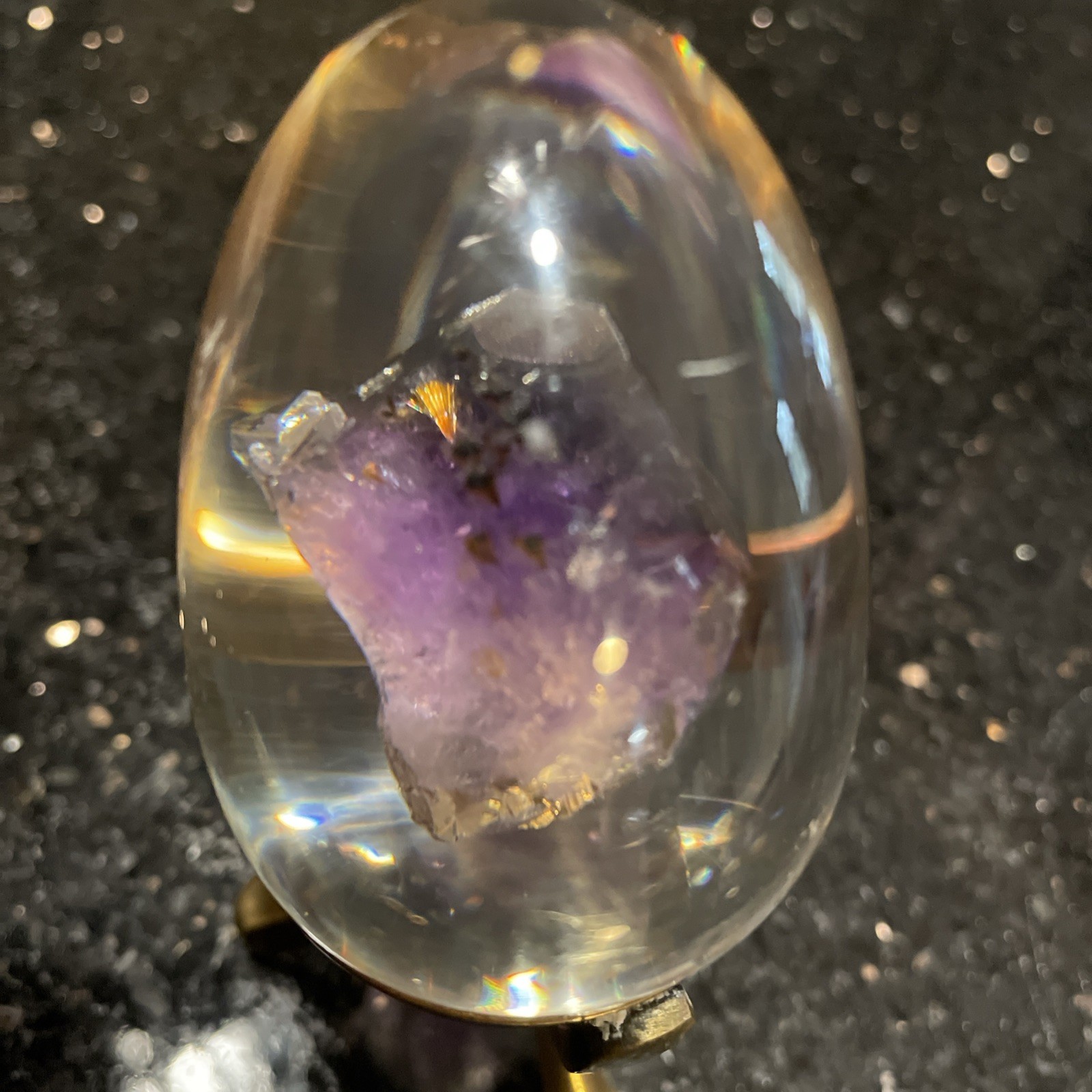 Amethyst Egg Encased In Lucite With Linear Inclusions With Brass Stand