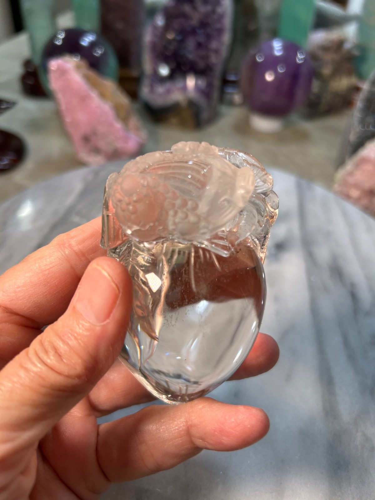 Clear quartz Golden Toad on peach carving very clear