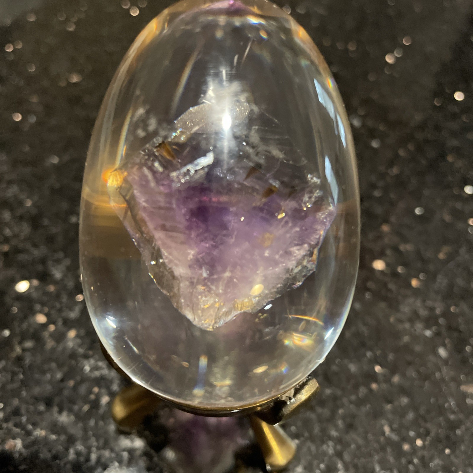Amethyst Egg Encased In Lucite With Linear Inclusions With Brass Stand