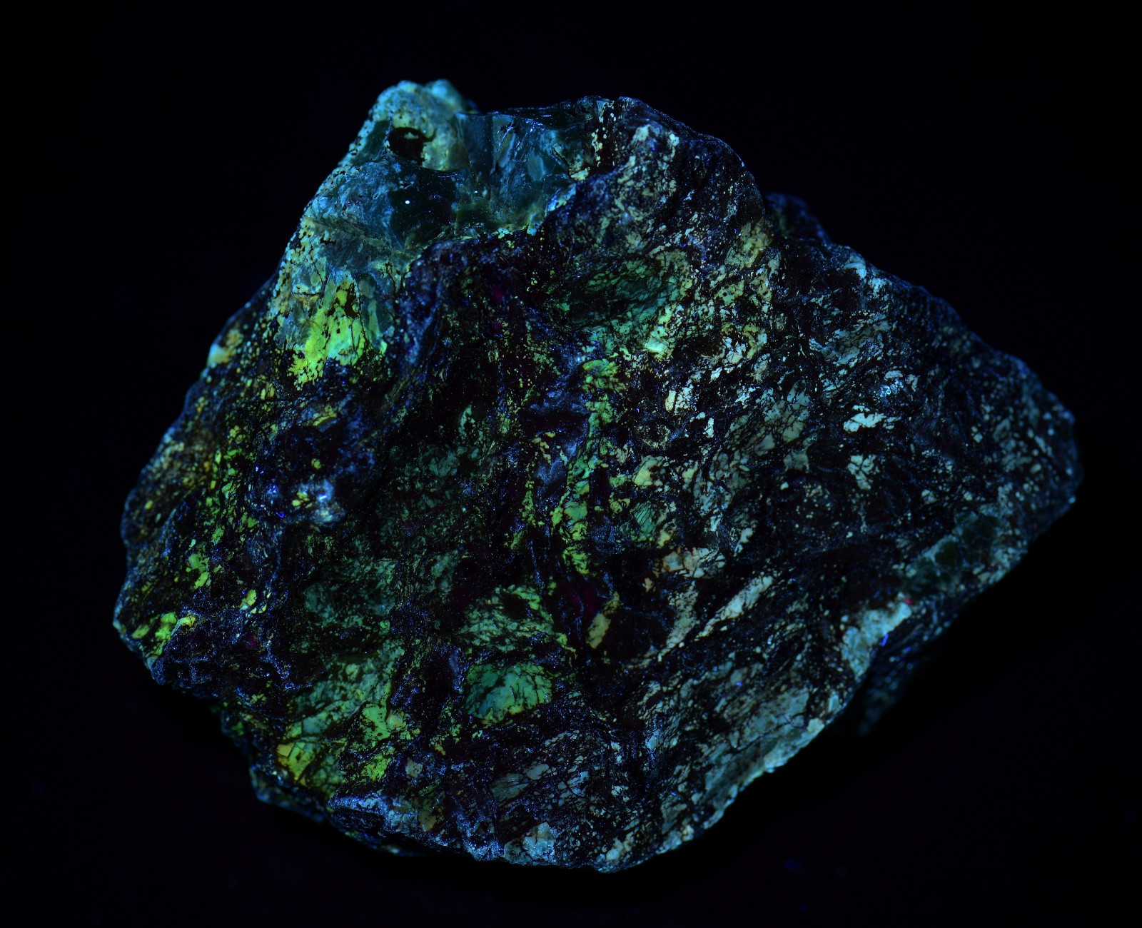 Opal on Sepentine with Magnetite, UV. San Benito, California. 213 grams.