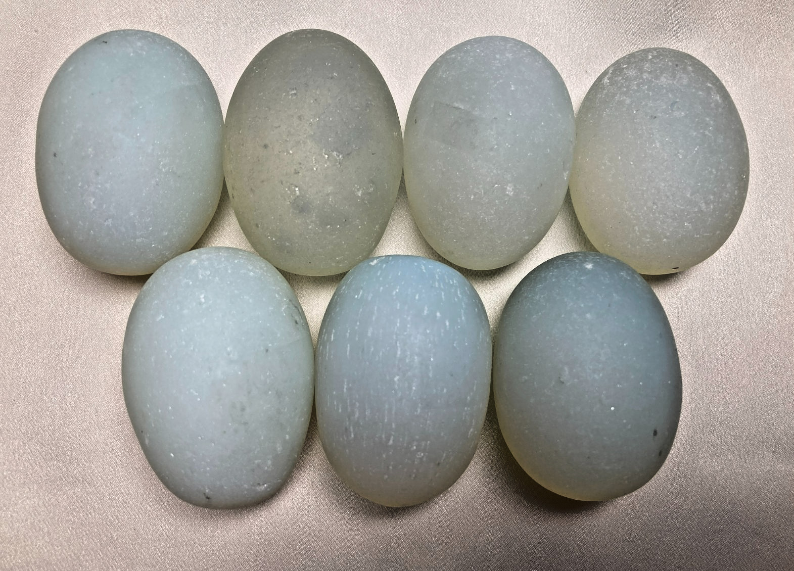 Seven Opalite Glass Eggs; 2 Inches Long; Milky Blue to Blue Green in Color