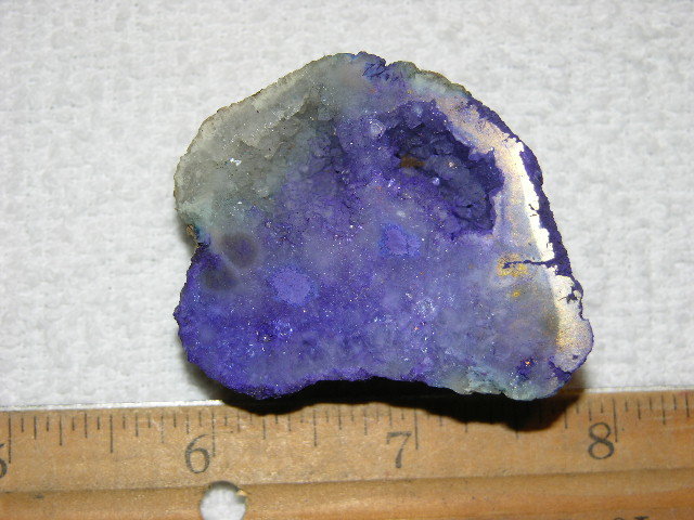 Geode cut & polished half with colored crystal center 2 inch E11