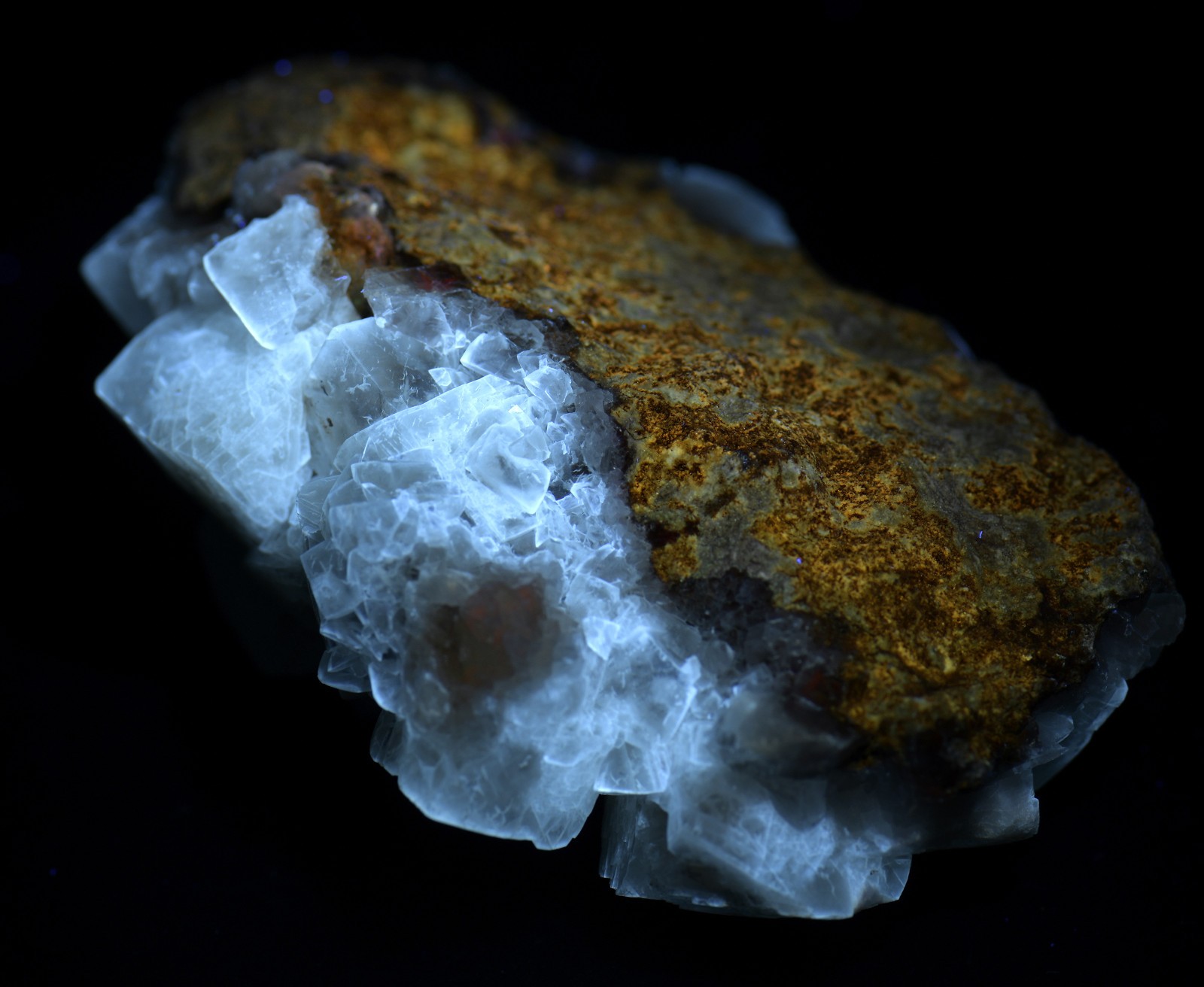 Calcite crystals on matrix, unique form, fluorescent white. 215 grams.