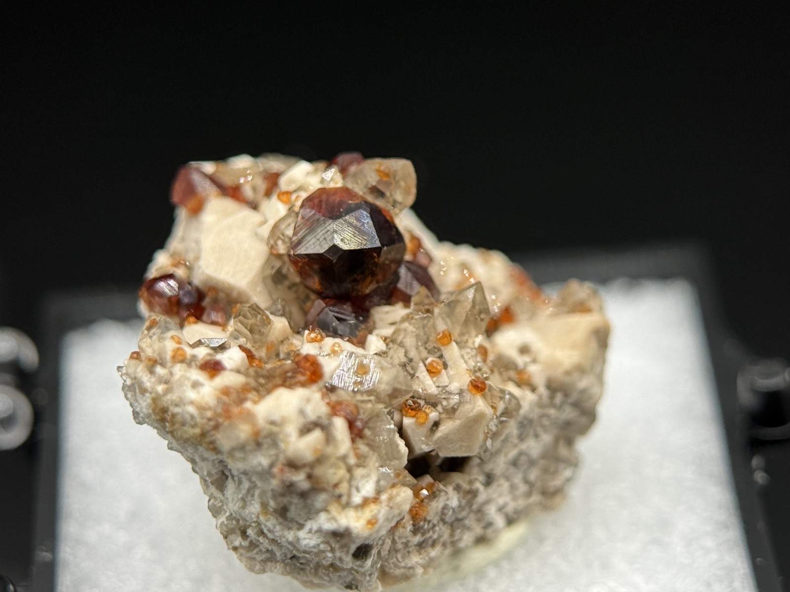 Exceptional spessartine garnets on smoky quartz & microcline from Fujian, China
