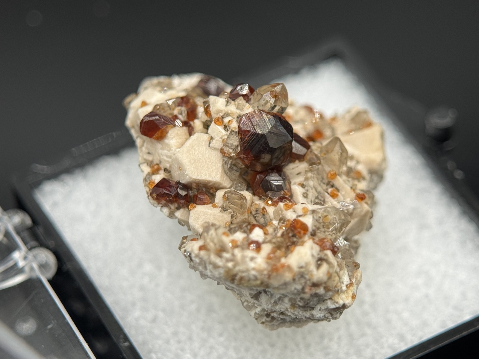 Exceptional spessartine garnets on smoky quartz & microcline from Fujian, China