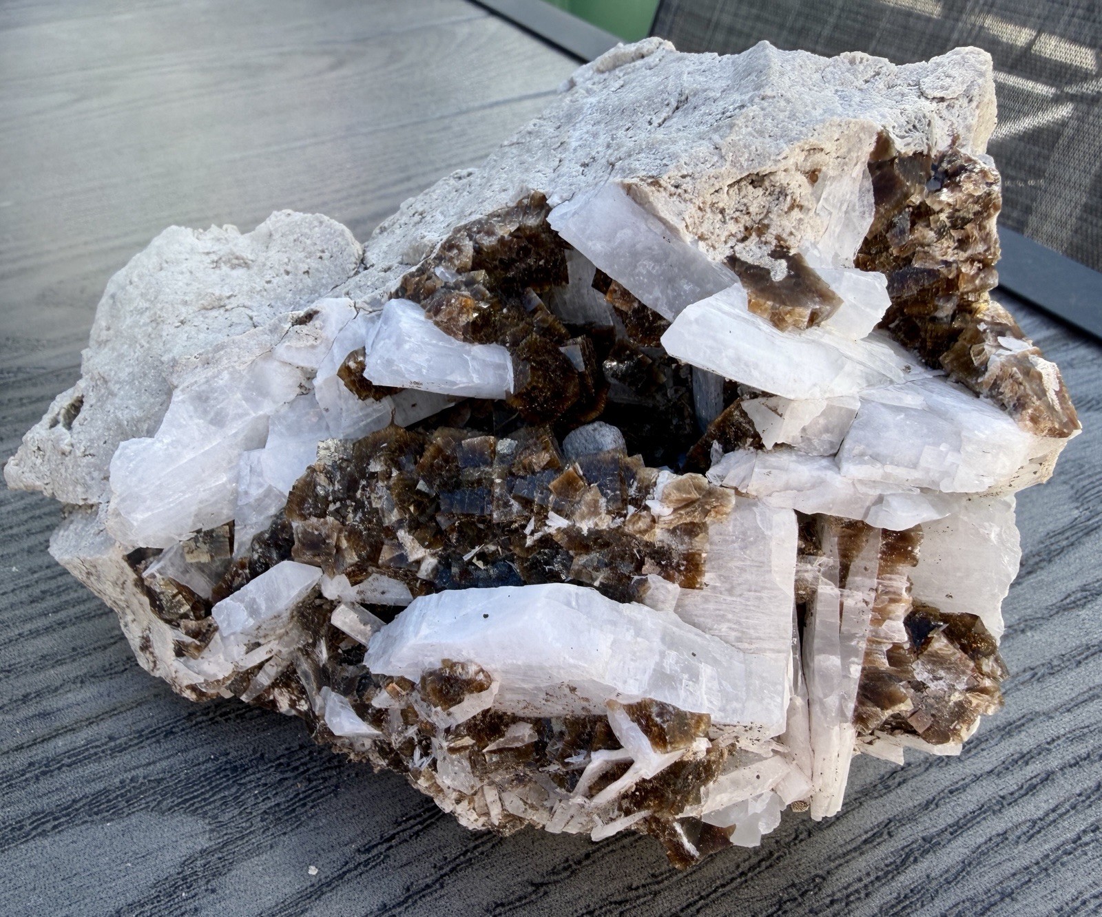 Mineral specimen containing brown fluorite and white celestite crystals.