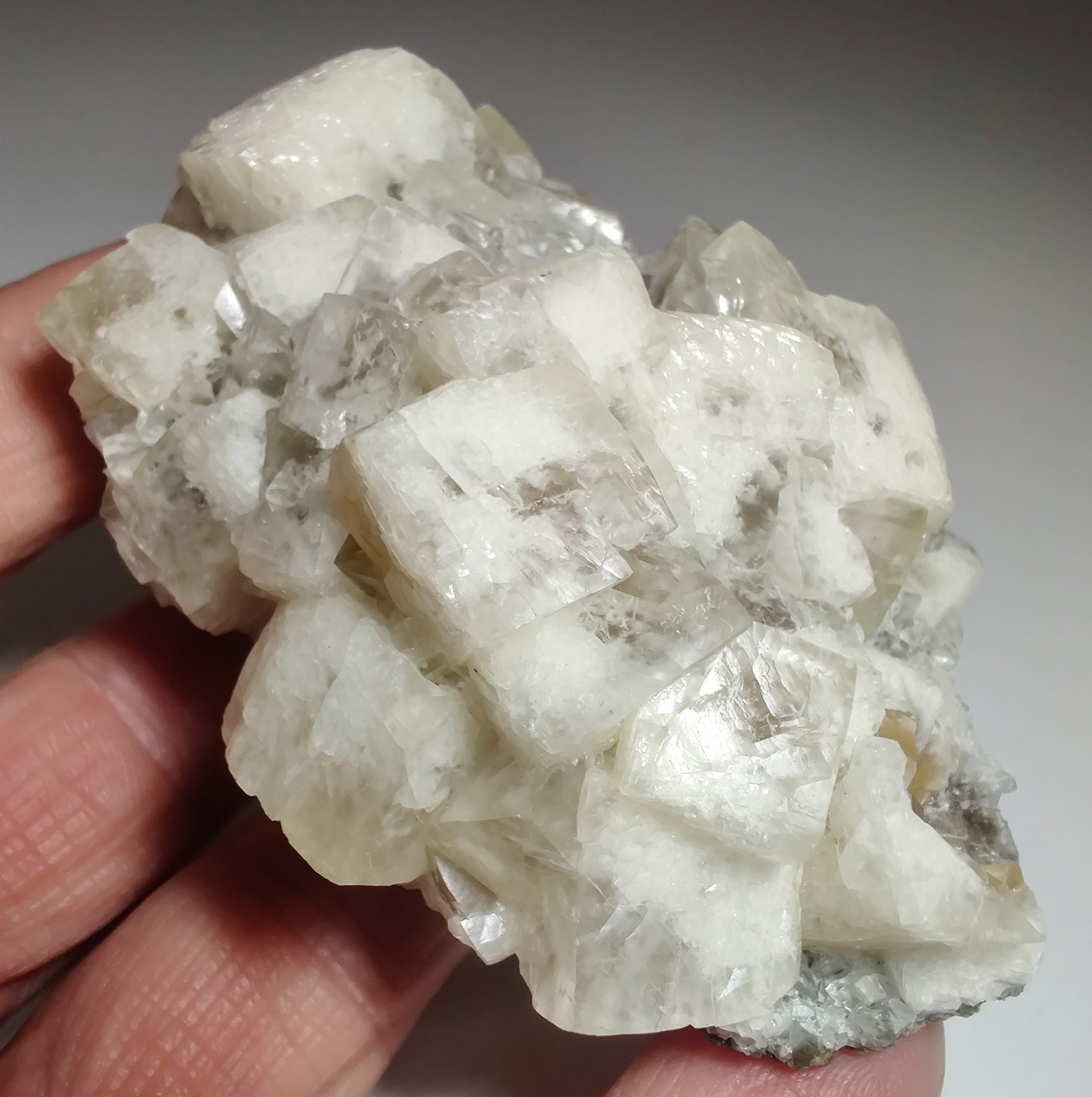 Calcite crystals on matrix, unique form, fluorescent white. 215 grams.