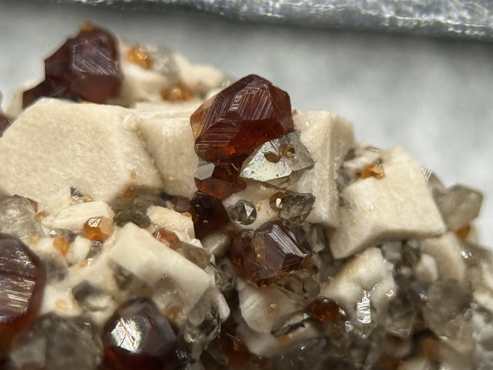 Exceptional spessartine garnets on smoky quartz & microcline from Fujian, China