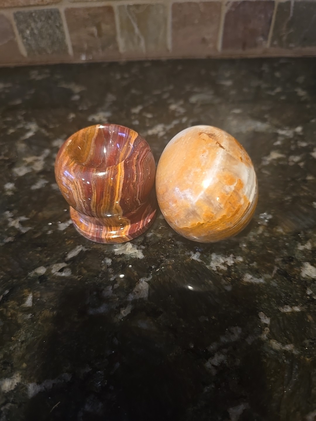 Polished Banded Onyx Egg On A marble Stand