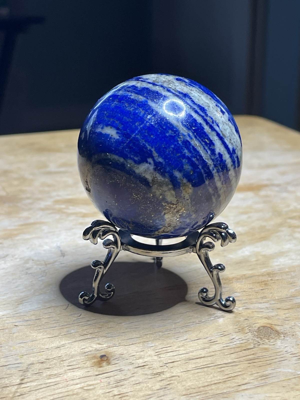 Polished Lapiz Lazuli Sphere with Pyrite Inclusions on Display Stand