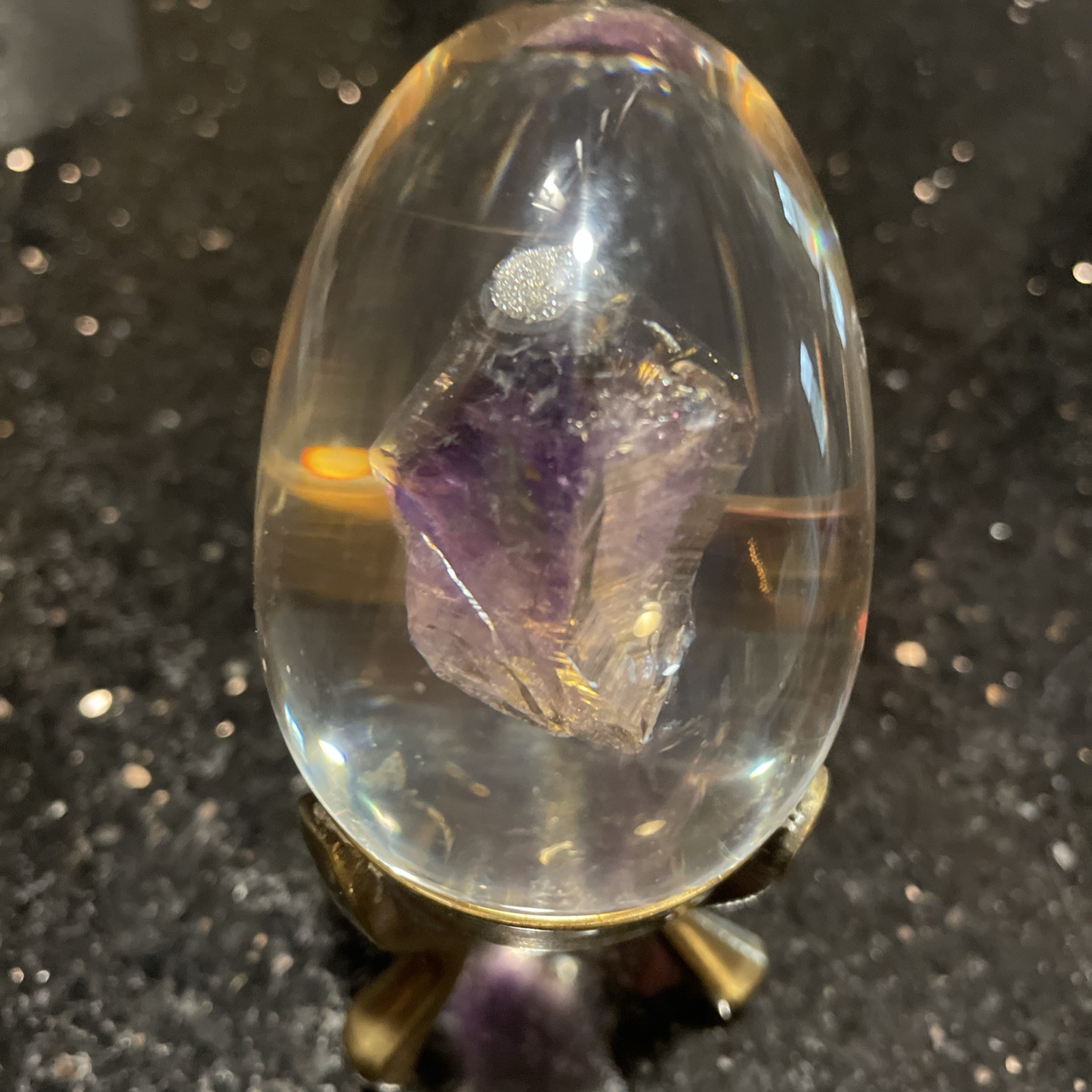 Amethyst Egg Encased In Lucite With Linear Inclusions With Brass Stand