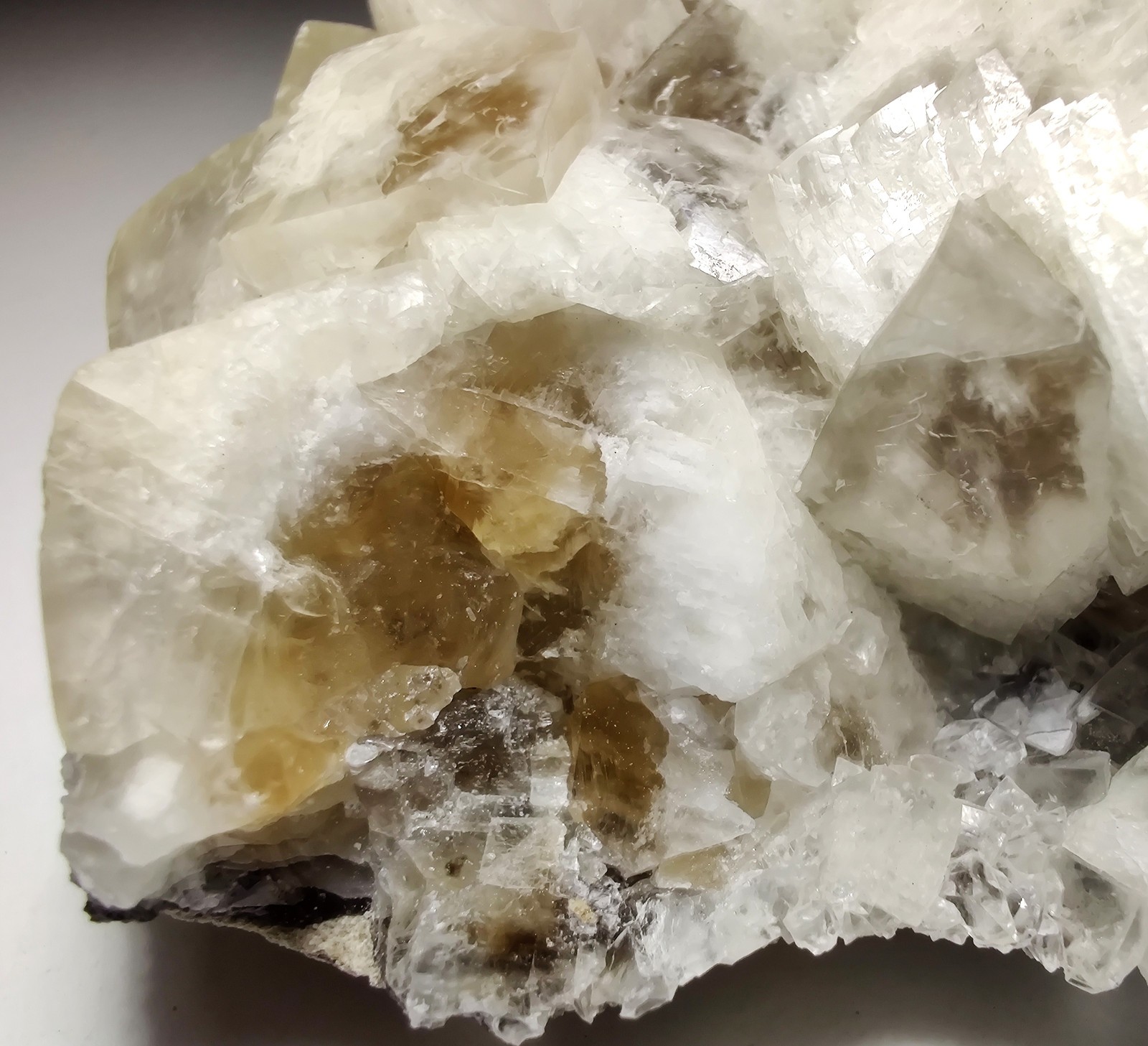 Calcite crystals on matrix, unique form, fluorescent white. 215 grams.