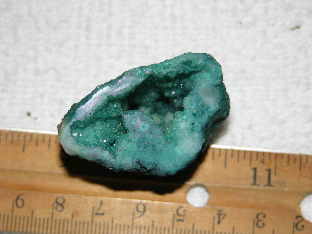 Geode cut & polished half with colored crystal center 1.5 inch E21