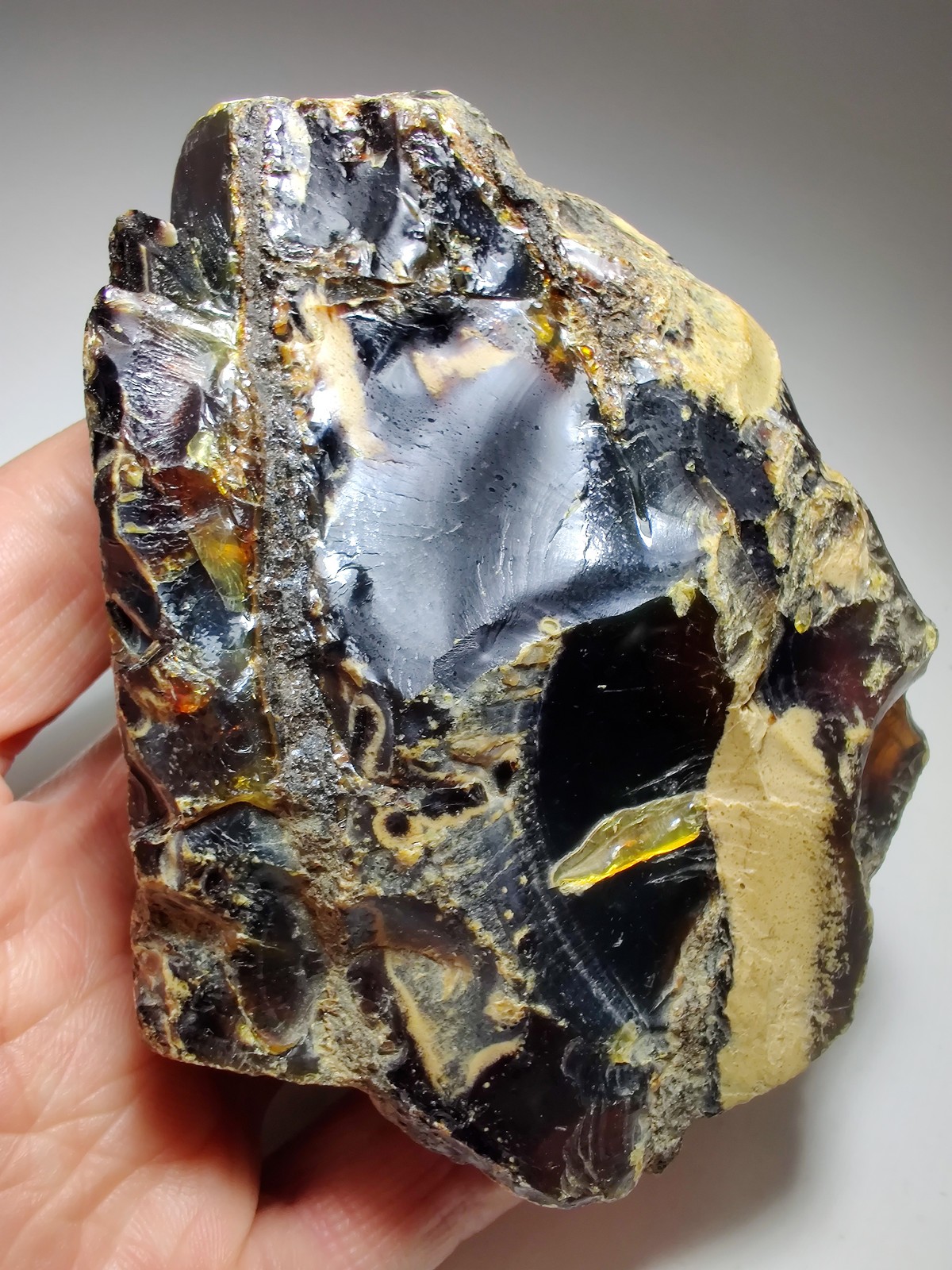 Amber, fluoresces blue. From Sumatra, Indonesia. 188 grams.
