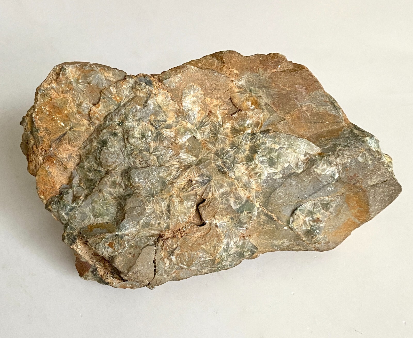 Wavellite starburst translucent crystal clusters on matrix, light green, brown