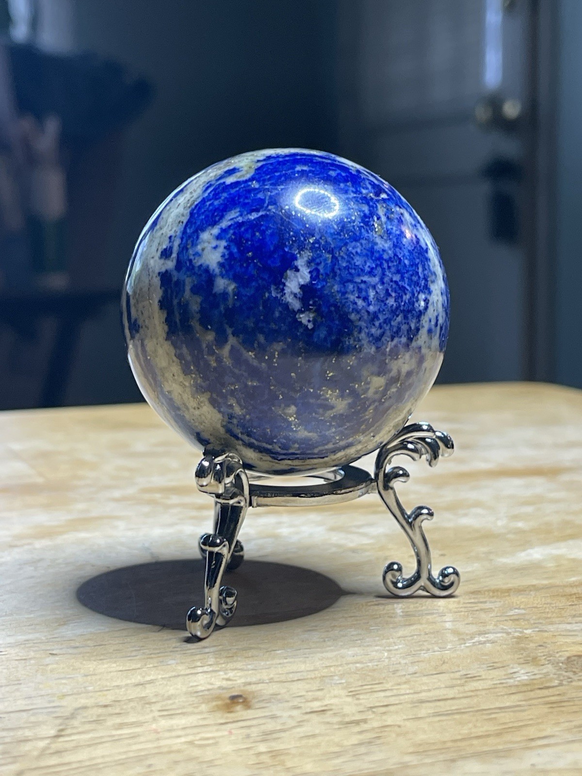 Polished Lapiz Lazuli Sphere with Pyrite Inclusions on Display Stand