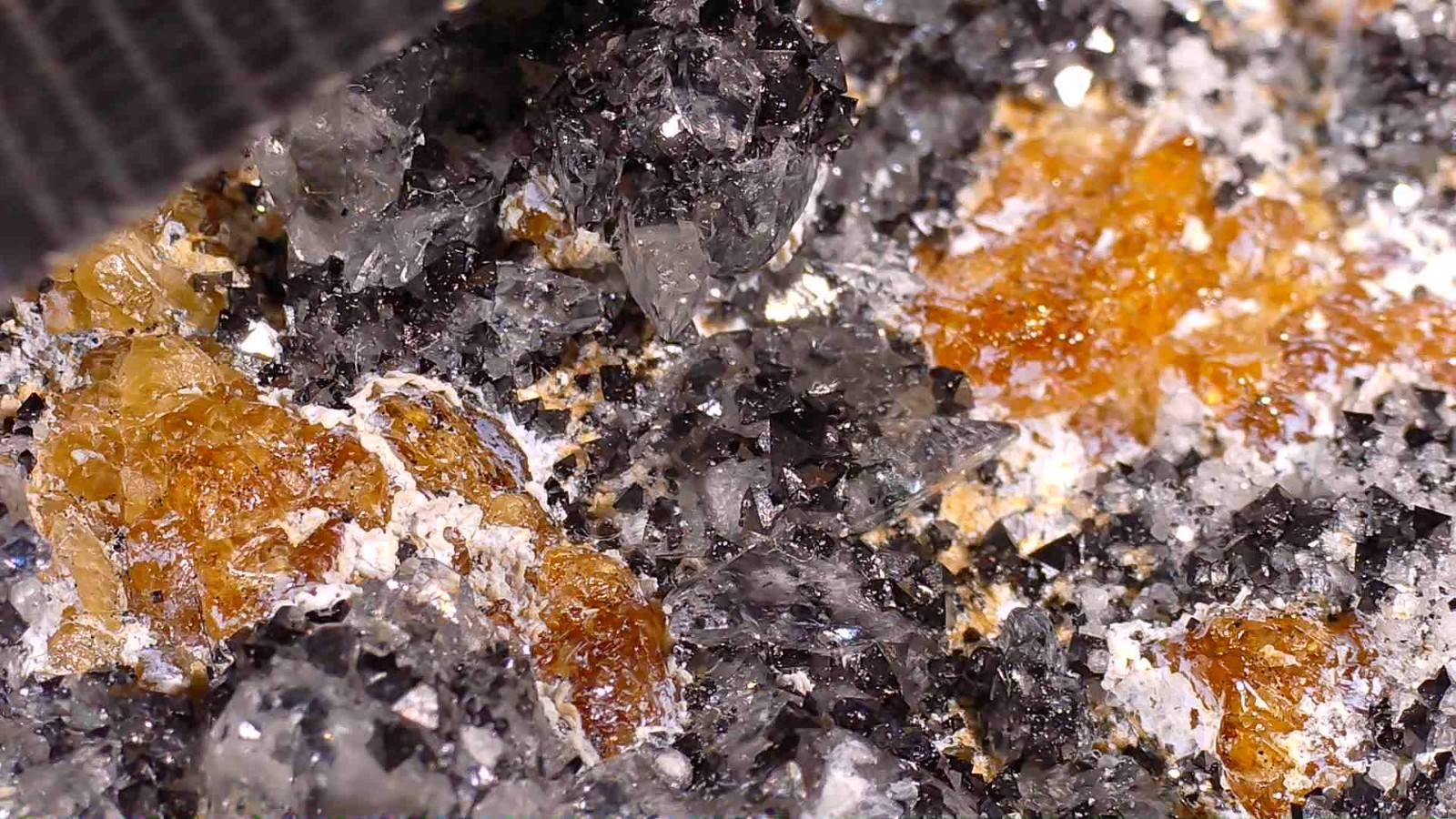Chondrodite with Magnetite, Quartz & Calcite (UV) – Palabora Mine, South Africa