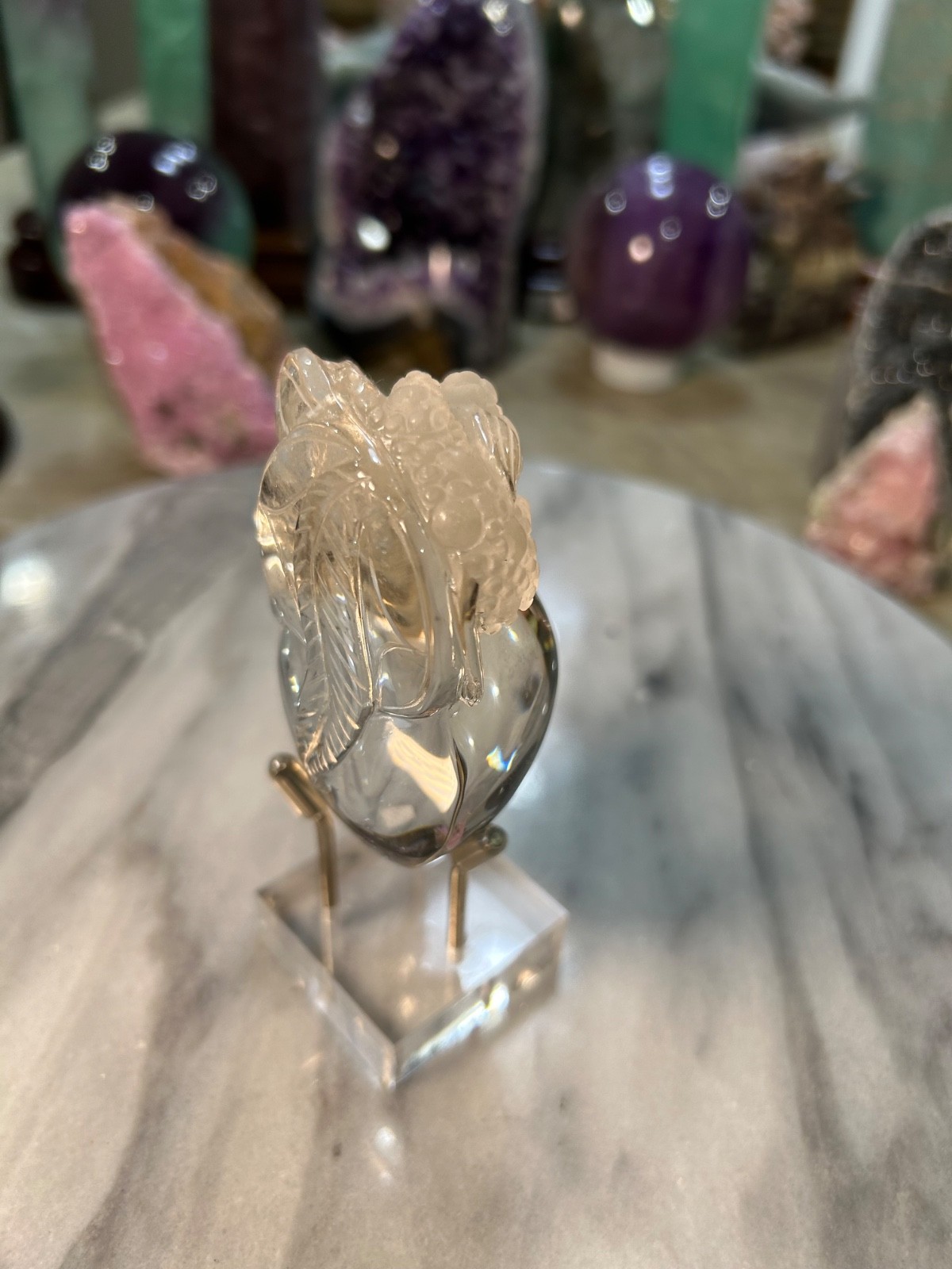 Clear quartz Golden Toad on peach carving very clear